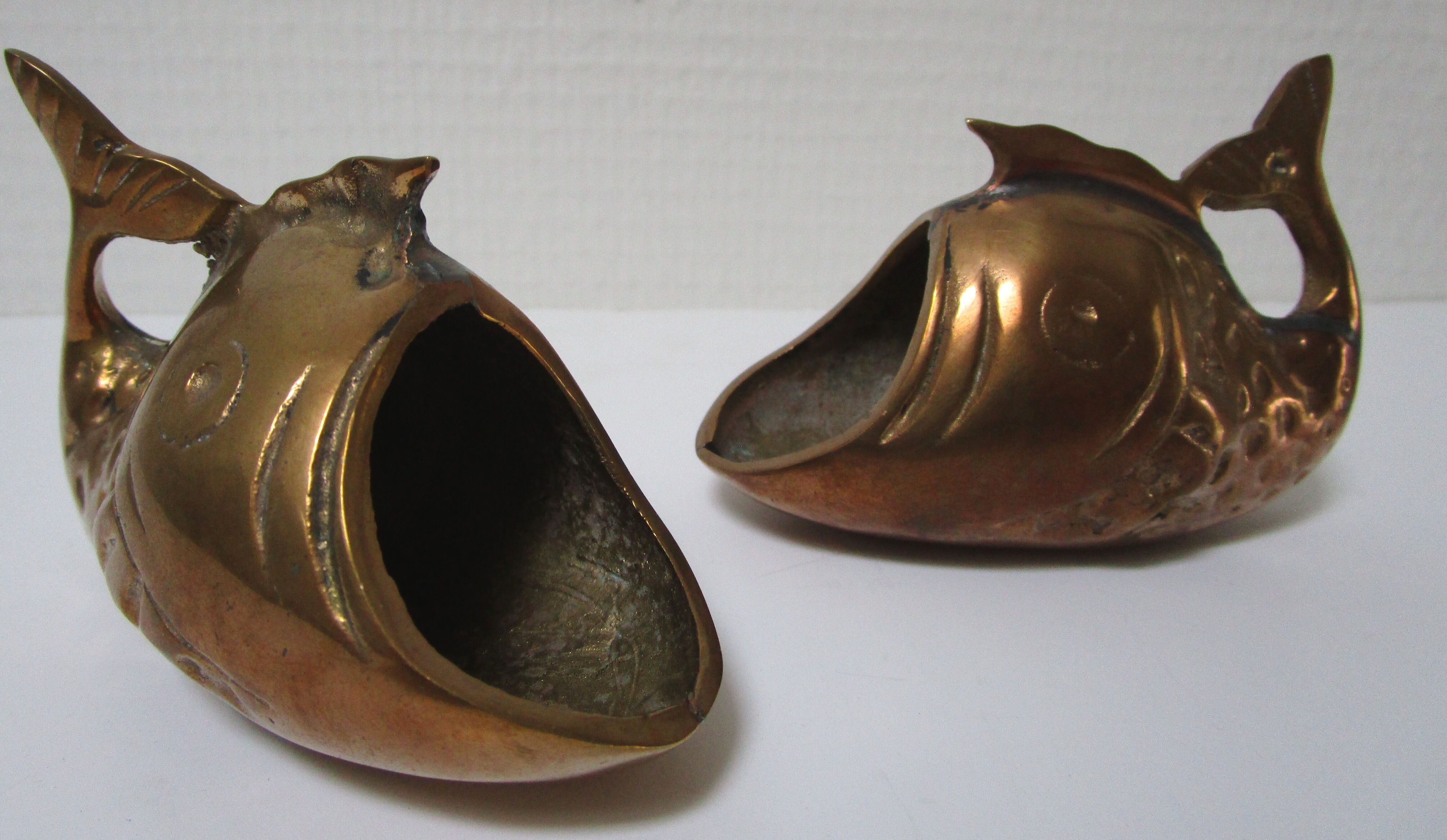 Two vintage brass fish ashtrays