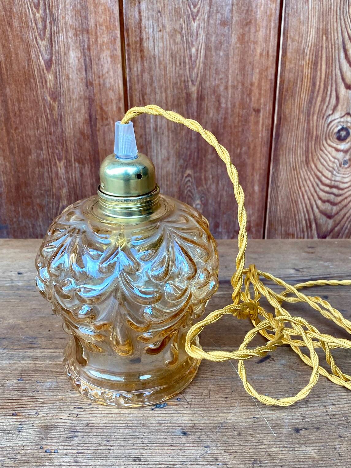 Vintage cut amber glass suspension globe.
