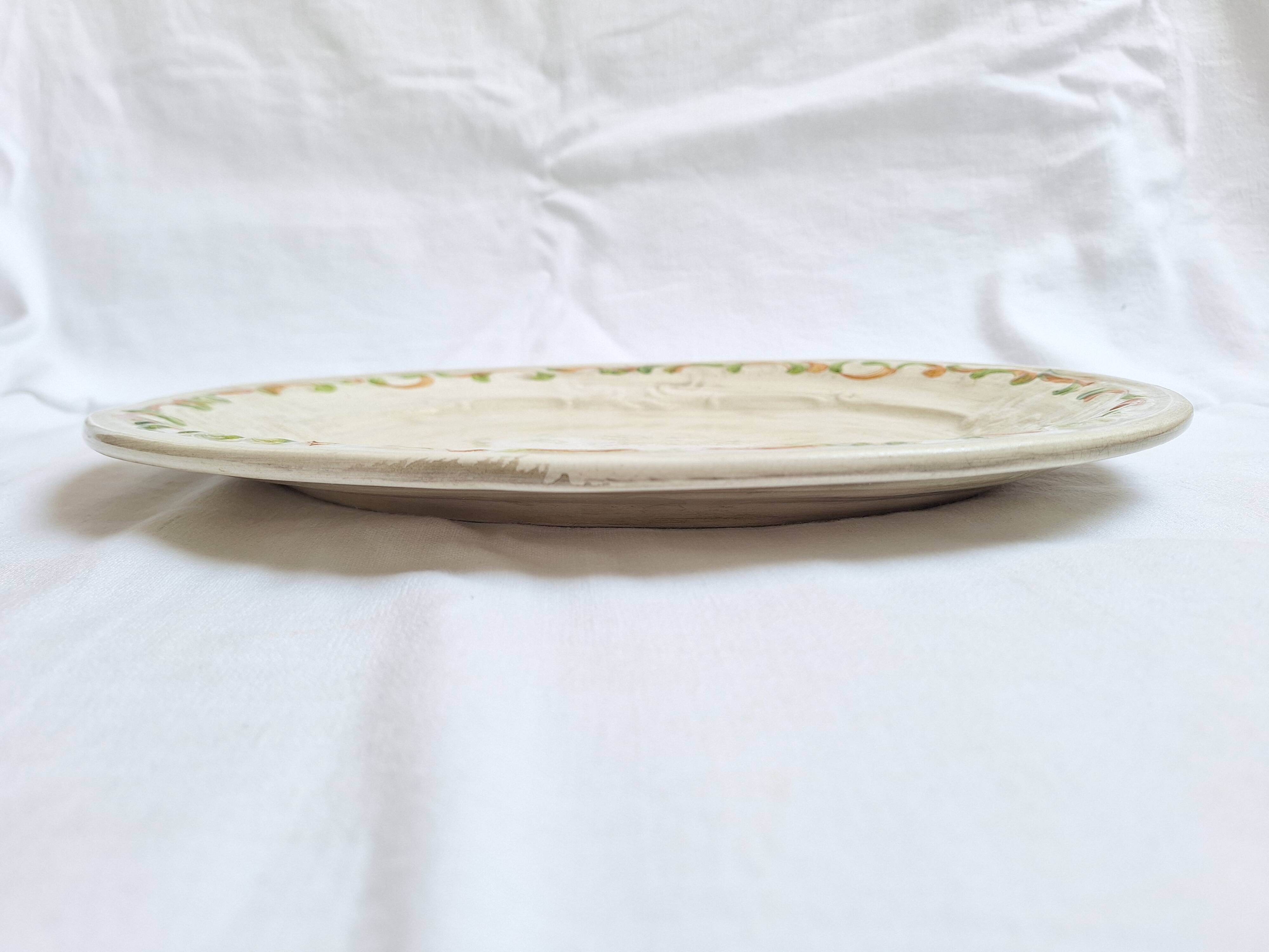 Oval plate, hand-painted meat platter in orange and green.