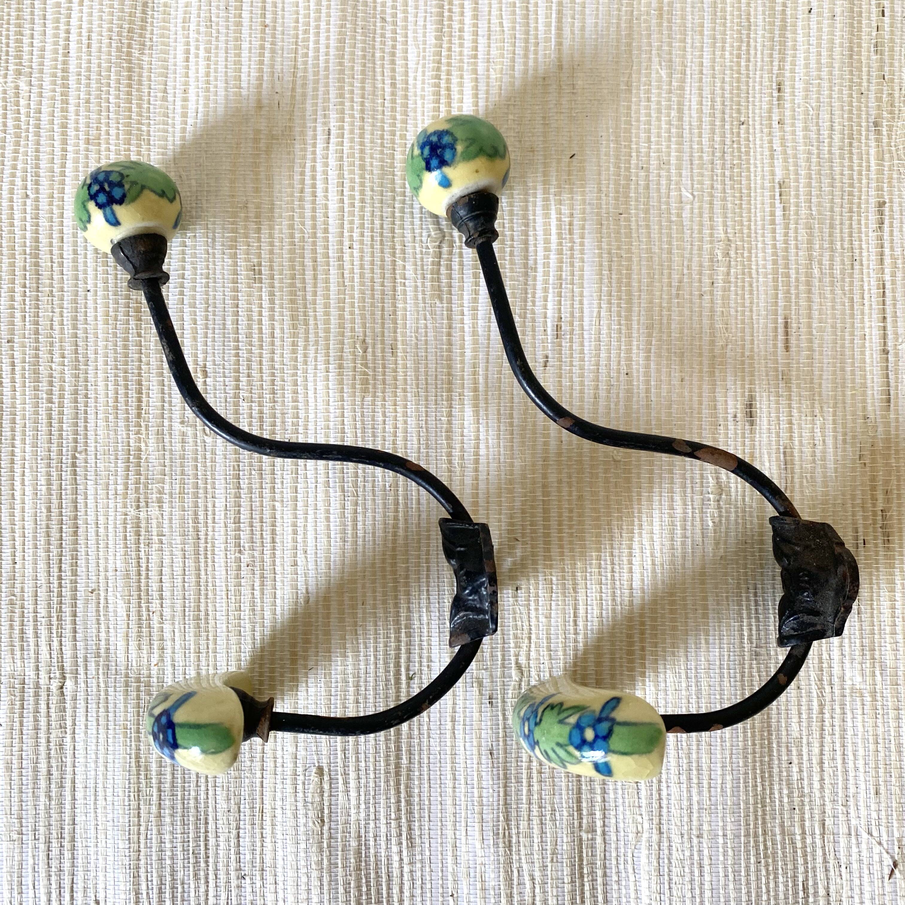 Metal and flowered ceramic coat hooks