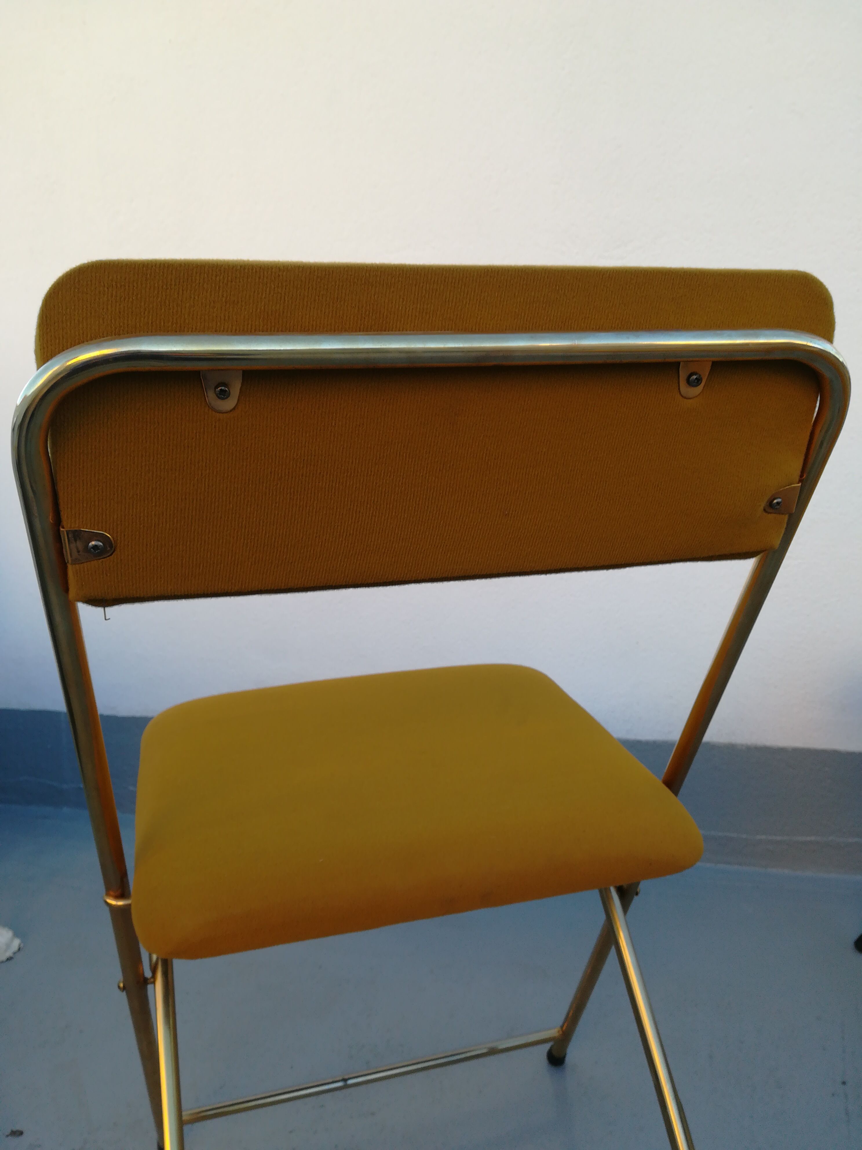 4 folding gold vintage Eyrel chairs