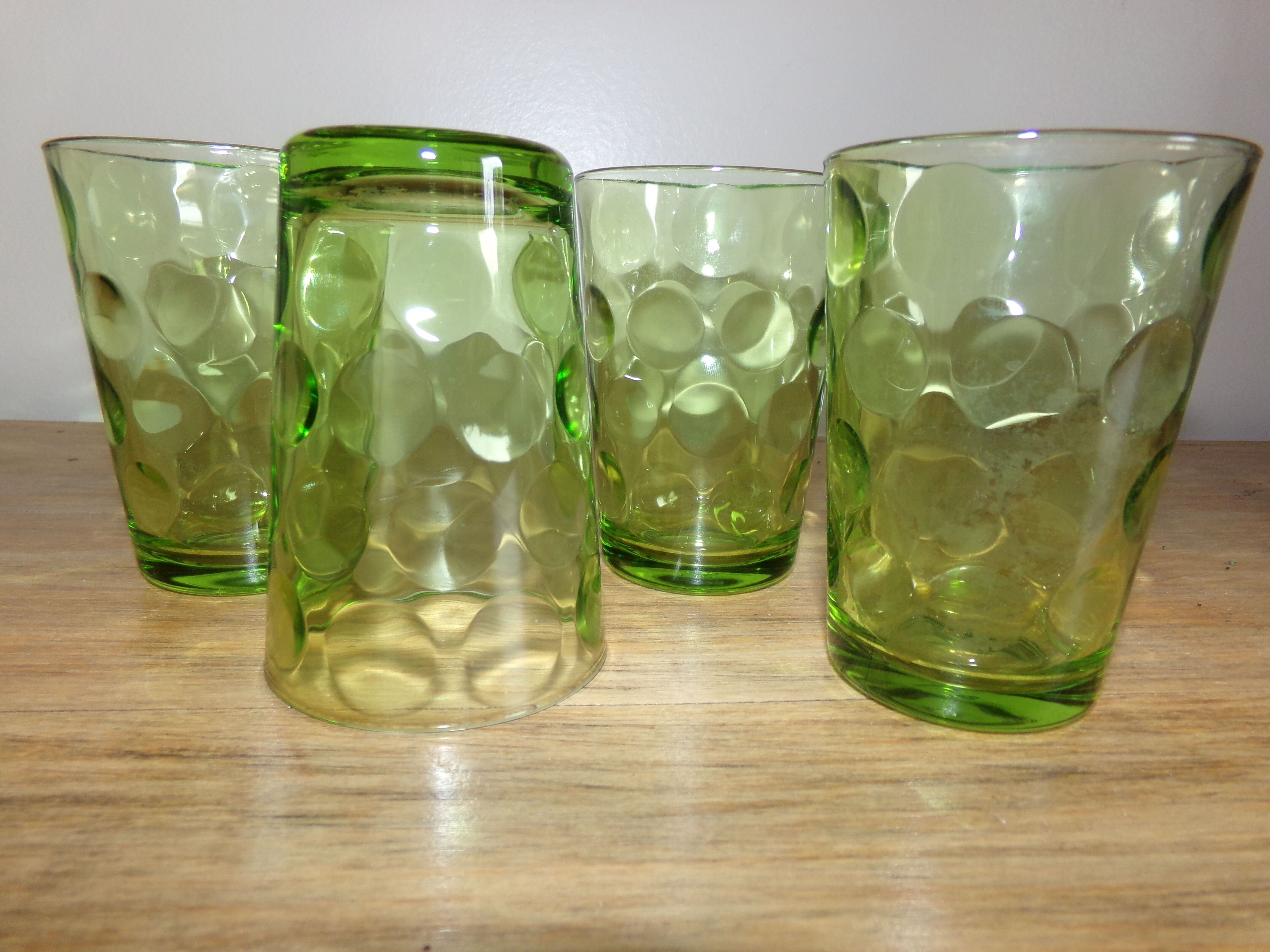 4 old green glasses