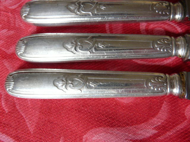 Series of 12 antique silver metal knives in their box