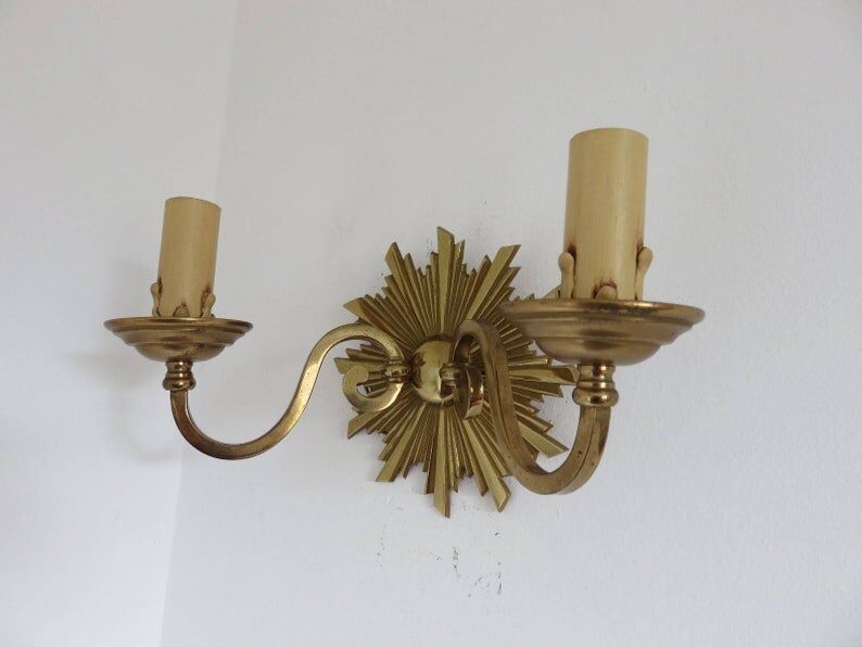 Wall lamp "little sun" in 70s golden brass