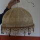 Suspension in lace and wooden beads