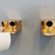 Wall lamps with milky white acrylic plastic shades and solid brass bases