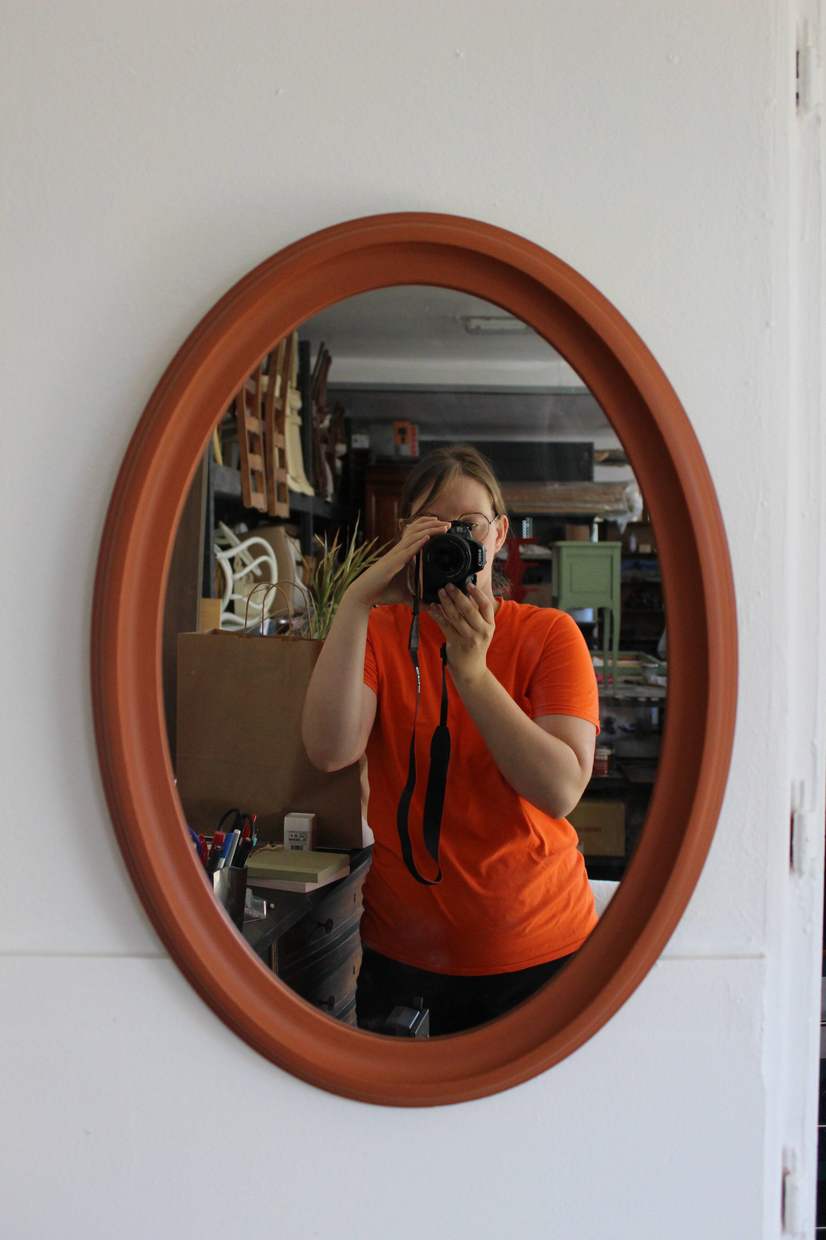 Terracotta patinated oval mirror