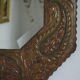 Antique bevelled artisanal mirror in repoussé copper - 54x45cm