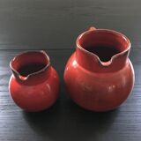 Pair of red pitchers
