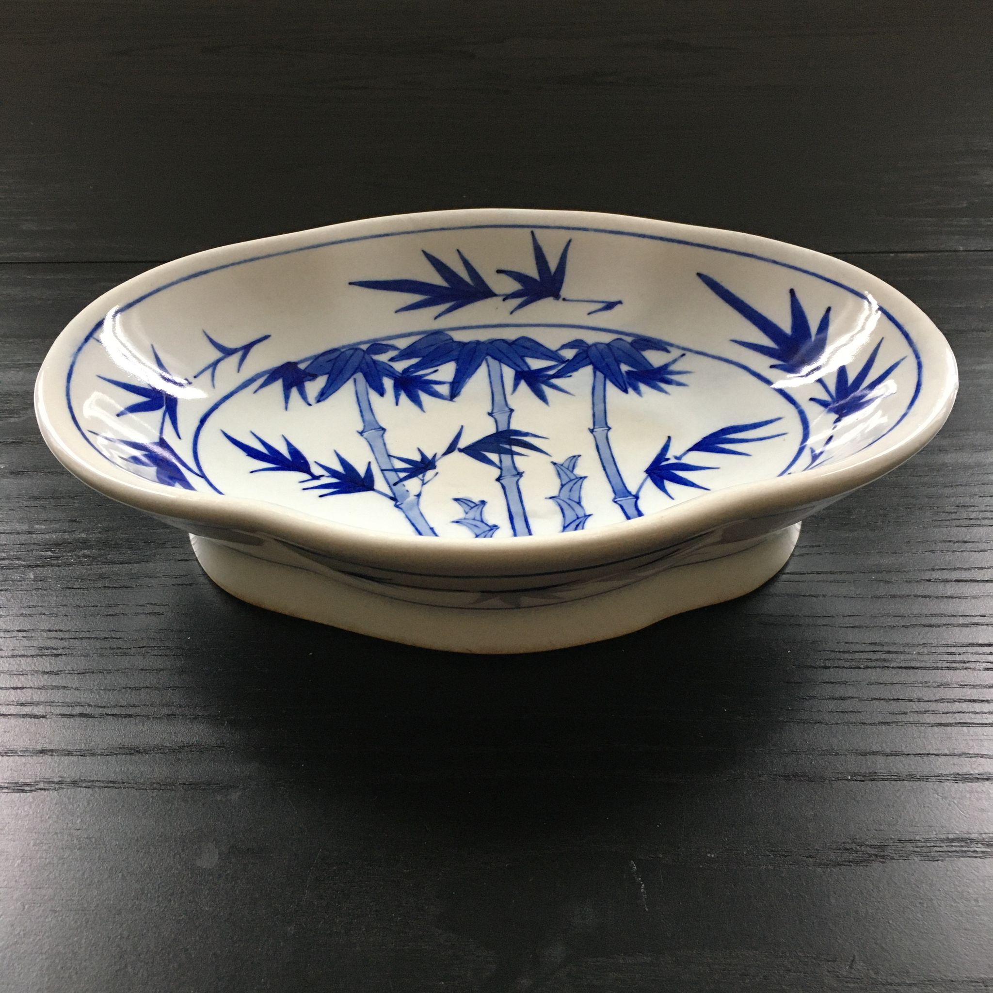 Chinese cup decorated with blue bamboo.