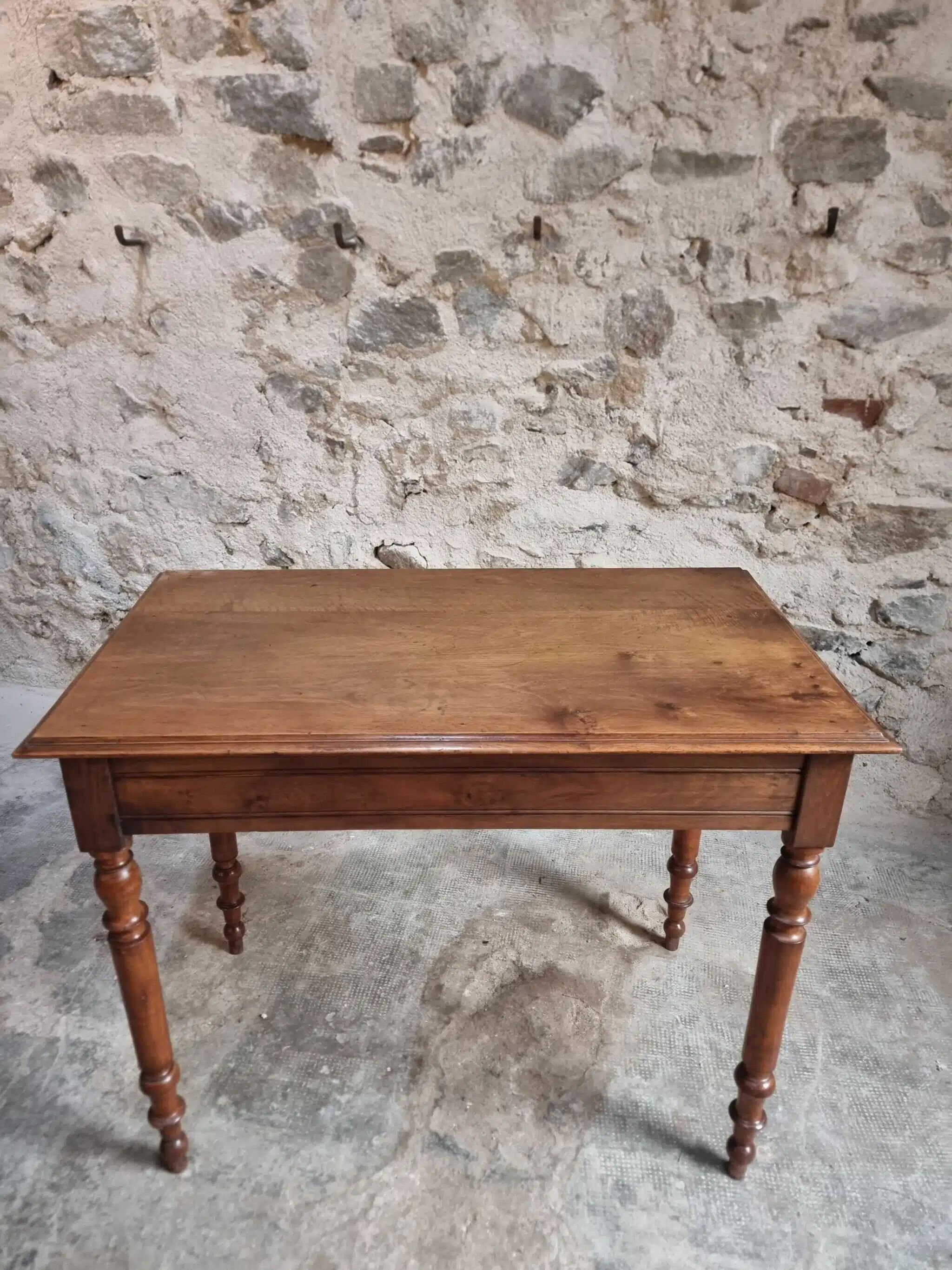 Antique French writing table in walnut with a drawer, circa 1900.