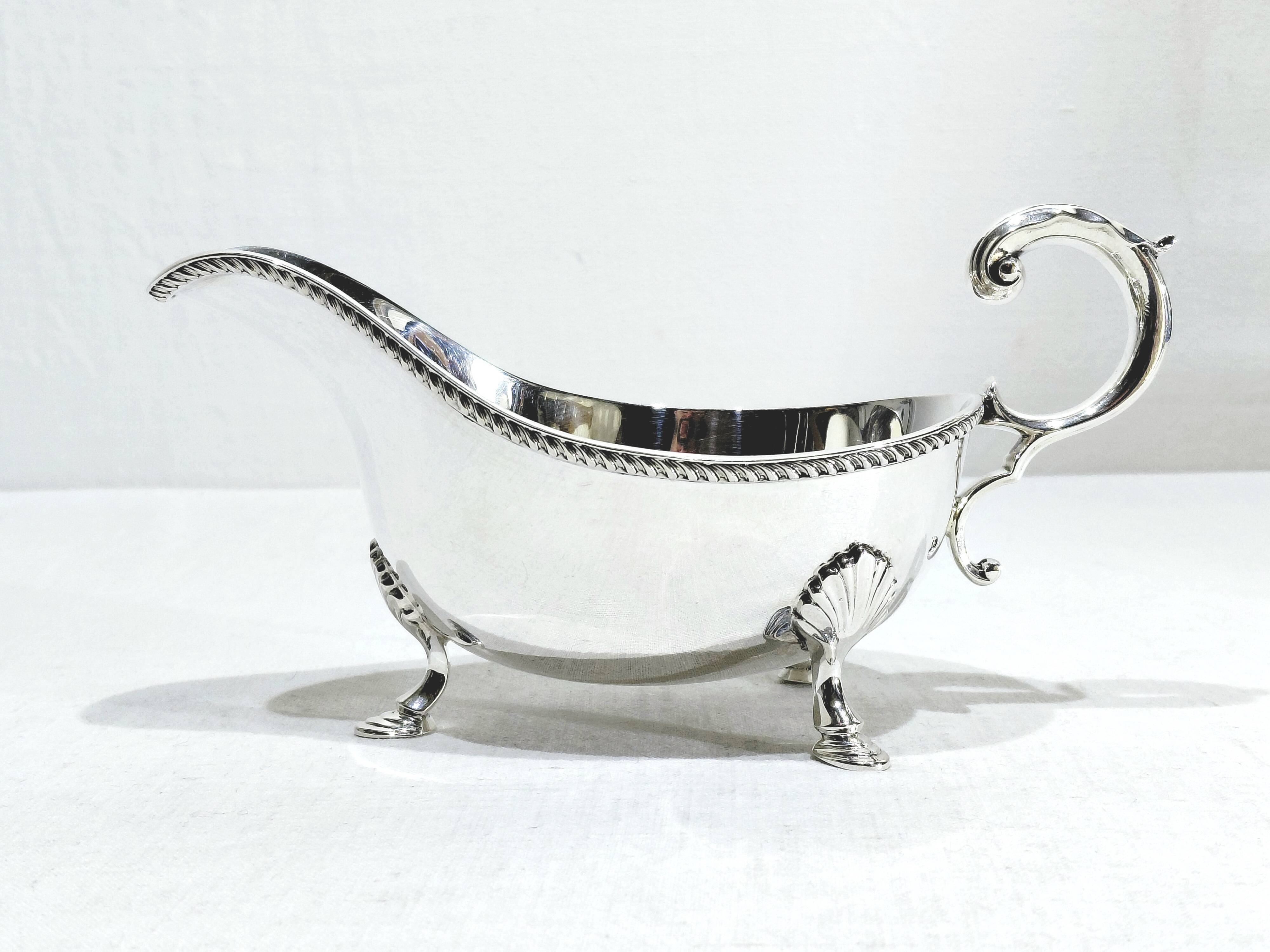 Silver sauceboat, England