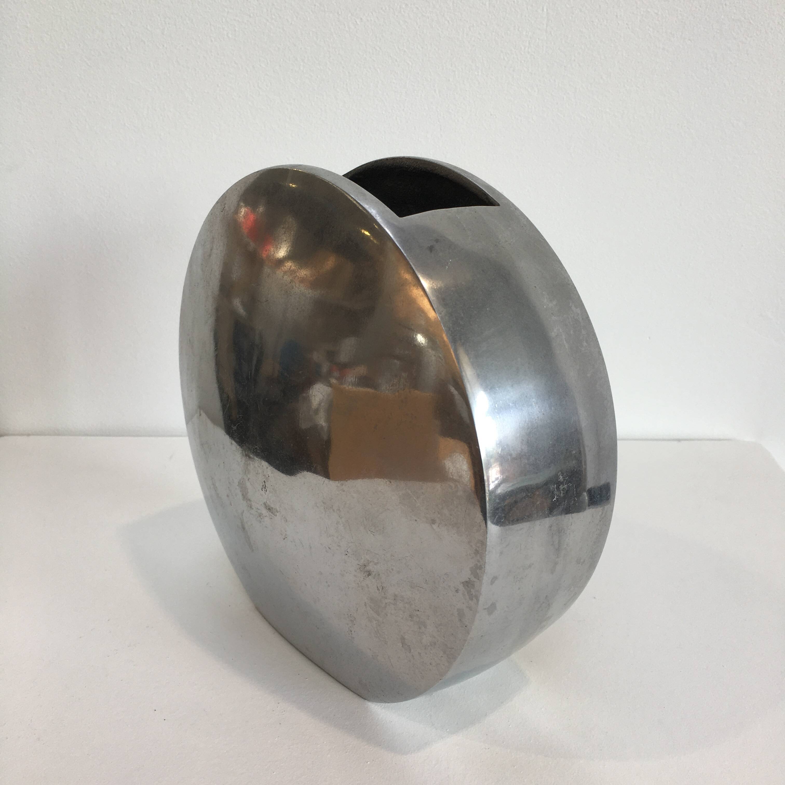 Series of two 70s style aluminum vases