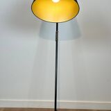 Design floor lamp in black lacquered metal and brass.