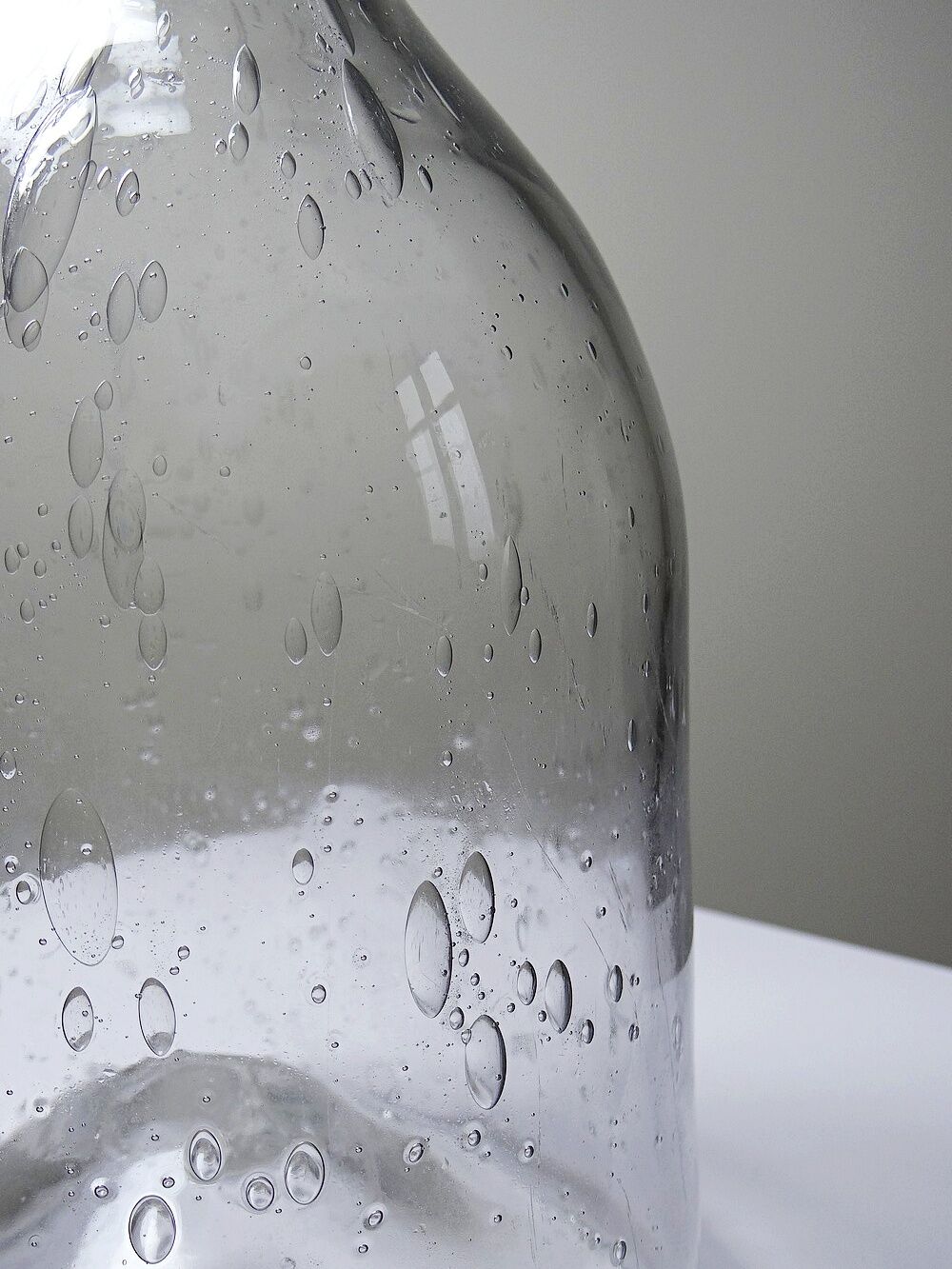 Large antique blown glass bottle with bubbles, early 20th century 1900-1920.