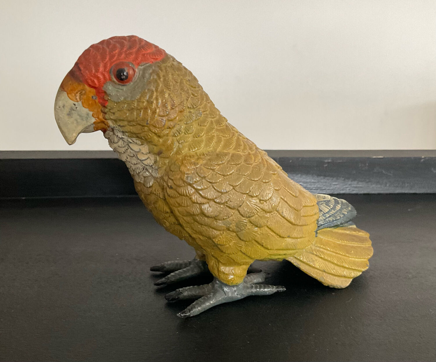 Vintage enamelled metal parakeet paperpress