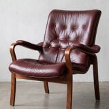 Scandinavian armchair with footrest