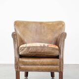 Nice, subtle cowhide armchair with a reversible kilim seat cushion