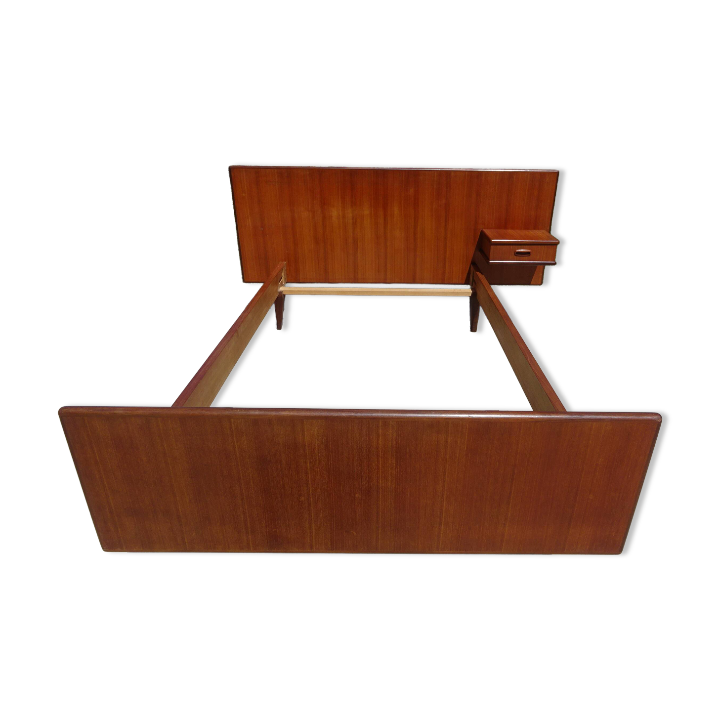 Vintage bed in teak with integrated bedside table.
