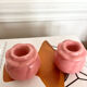 Pair of pink ceramic candle holders