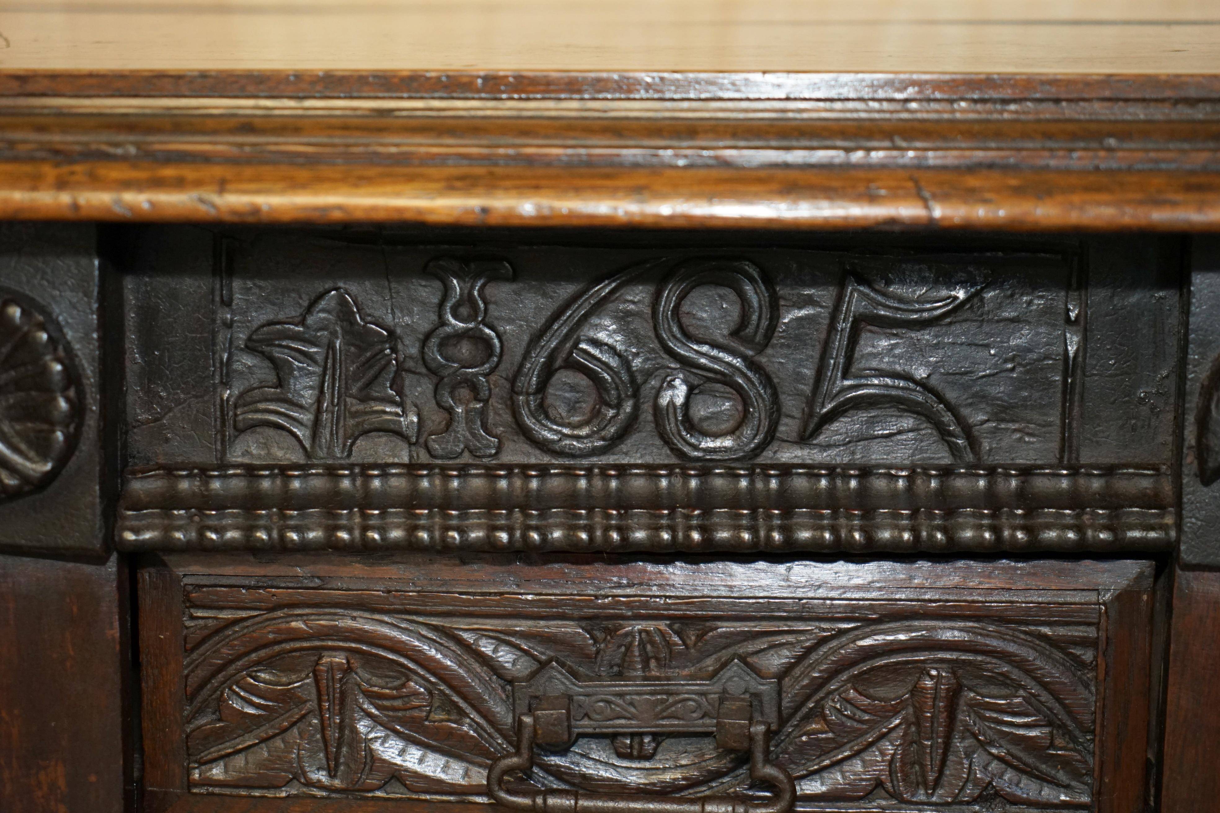 Hand-carved commode from 1685 with sideboards and side cupboards.