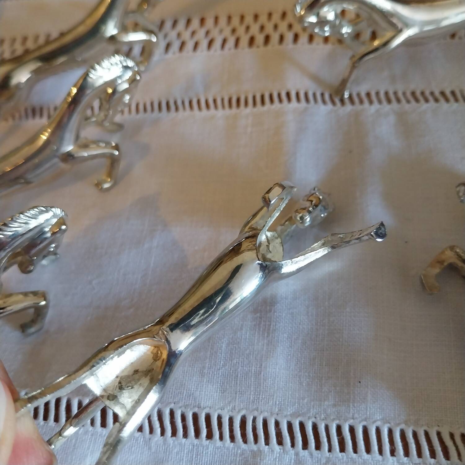 Silver metal horse-shaped knife rests