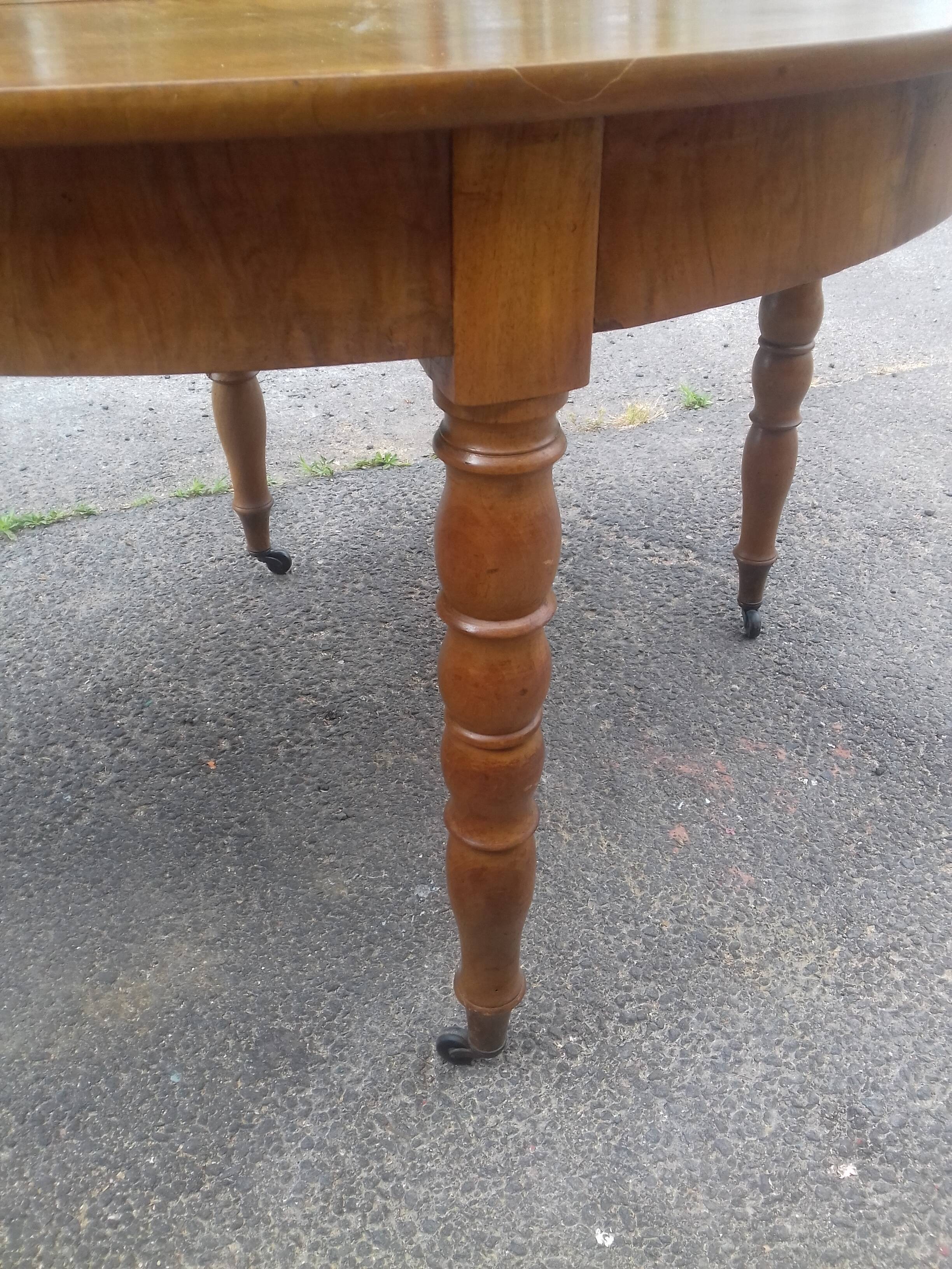Half-moon walnut console table, circa 1840, Jacob base