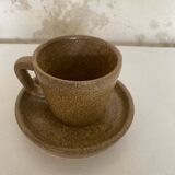Set of stoneware coffee cups with saucers