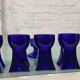 Set of 7 vintage cobalt blue glass footed candlesticks