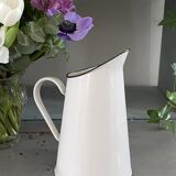 Old white enameled pitcher
