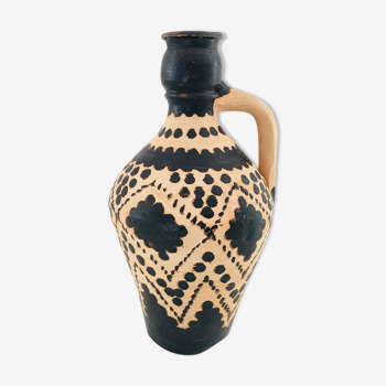 Raw and black terracotta jug
