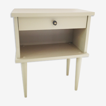 Vintage beige wooden bedside table