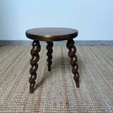 Wooden tripod stool with twisted legs