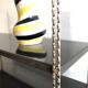 String shelf creation mofp gold and black