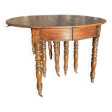 12-foot round oak table with 7 extensions / 20 people