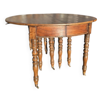 12-foot round oak table with 7 extensions / 20 people