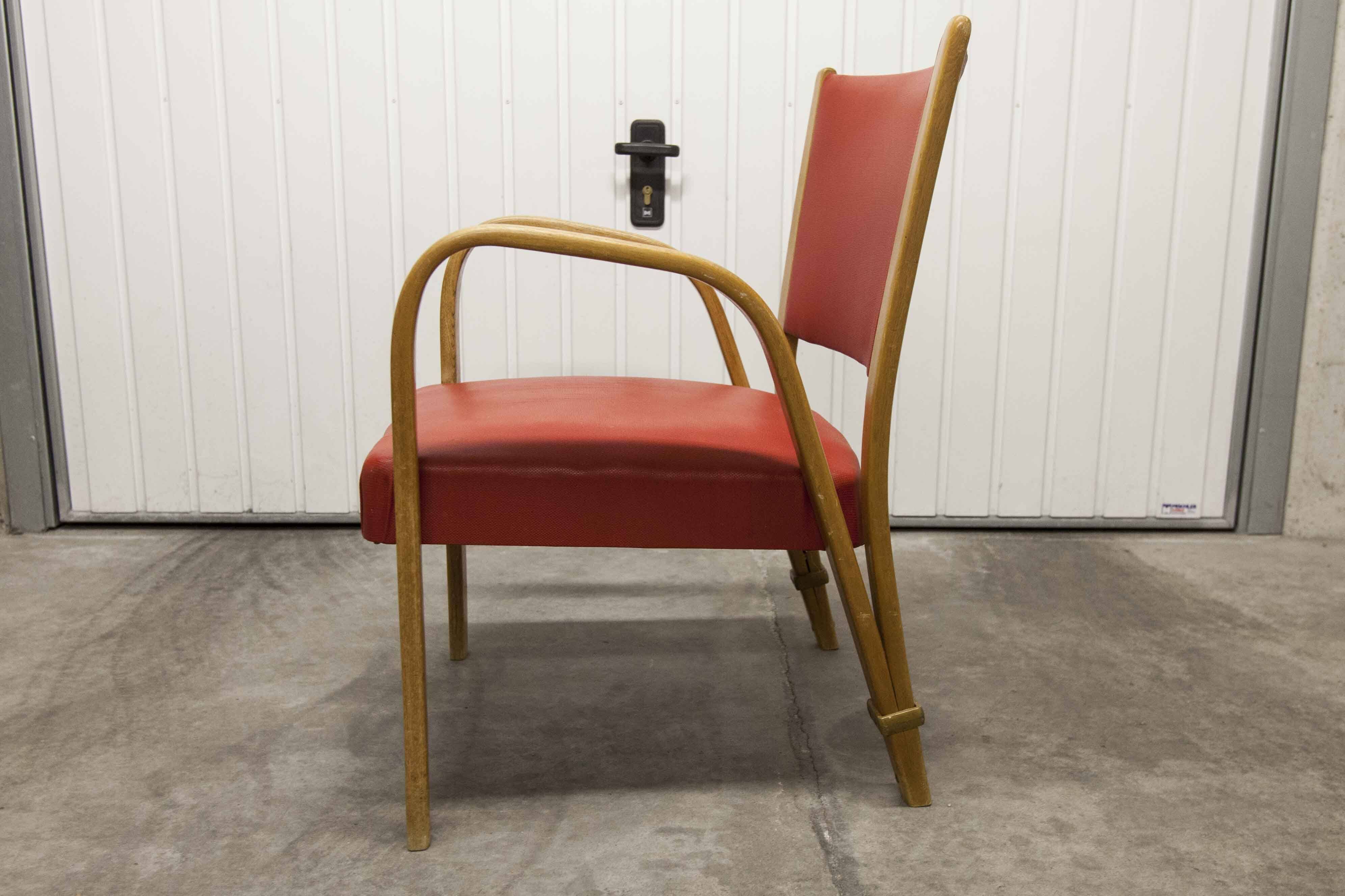 Bow wood armchair by Hugues Steiner 1960 red