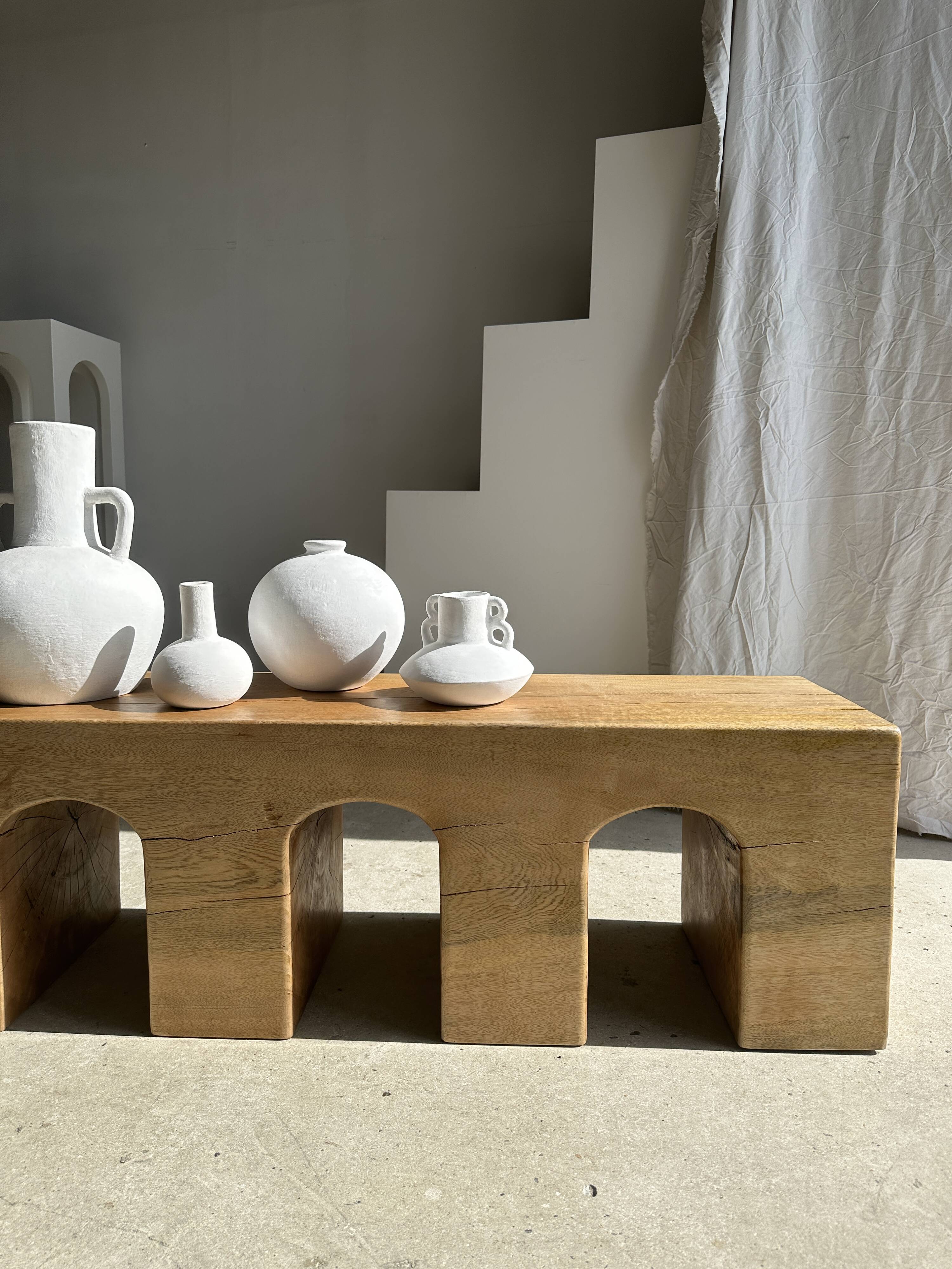 Solid monoxyl wood bench with carved 3-arch base - Natural wood color