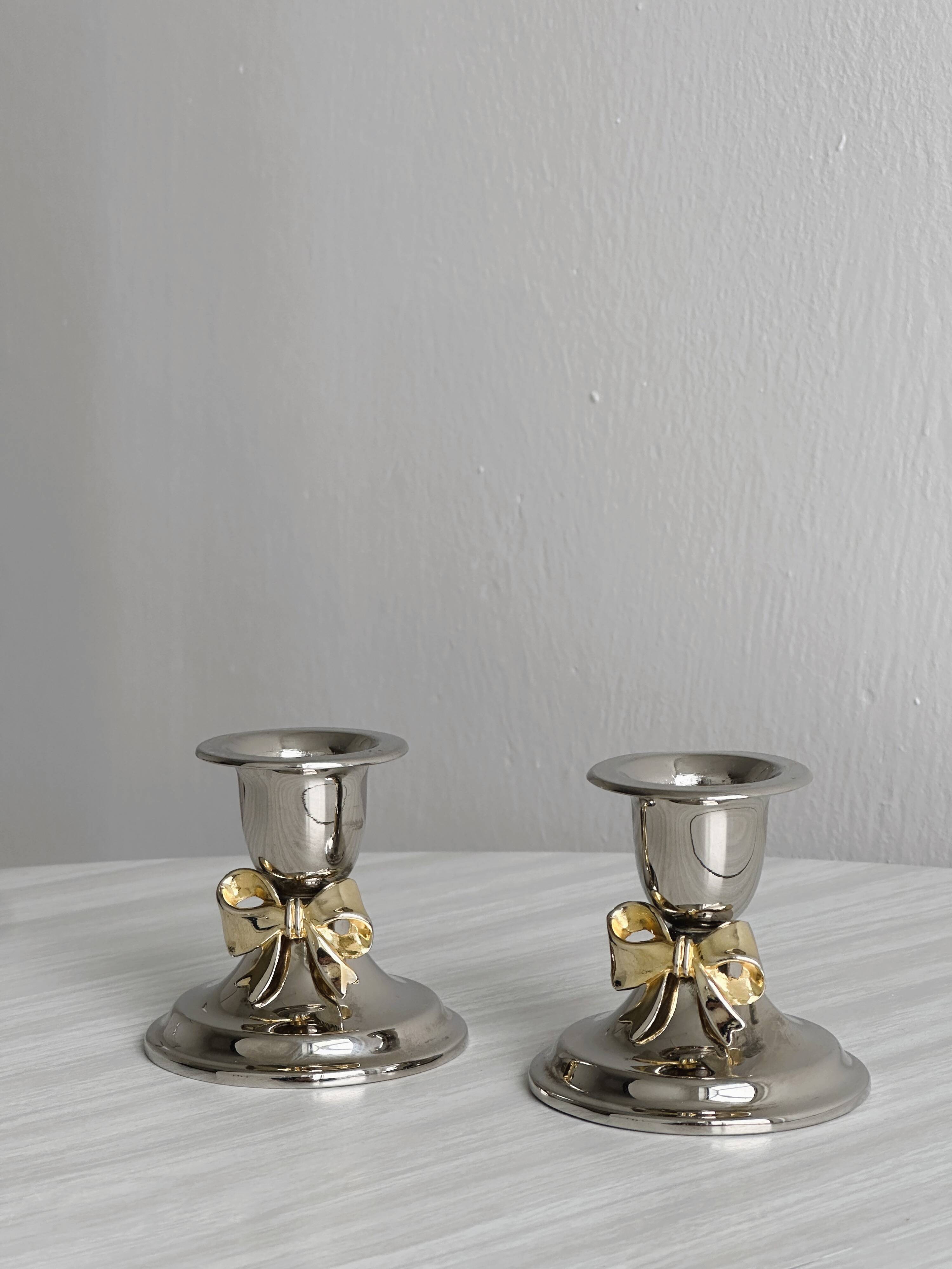 Pair of small antique metal candlesticks