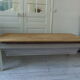 Coffee table made from an authentic farmhouse table, leg patinated pearl gray