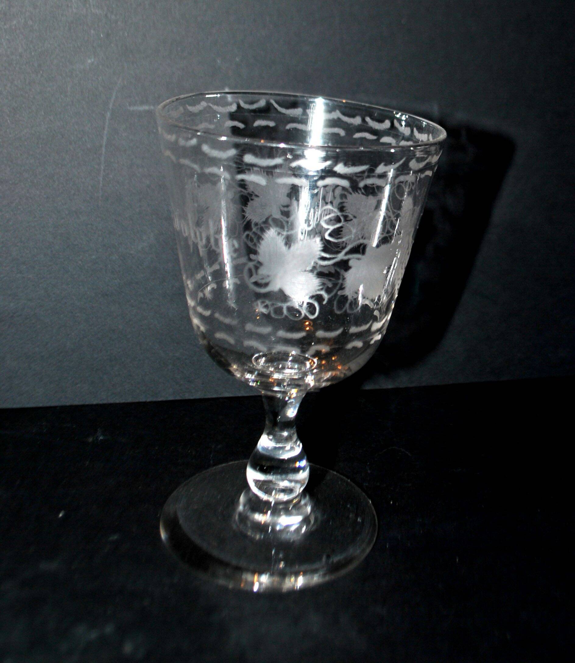 Antique souvenir glass tumbler engraved with the name Adolphe