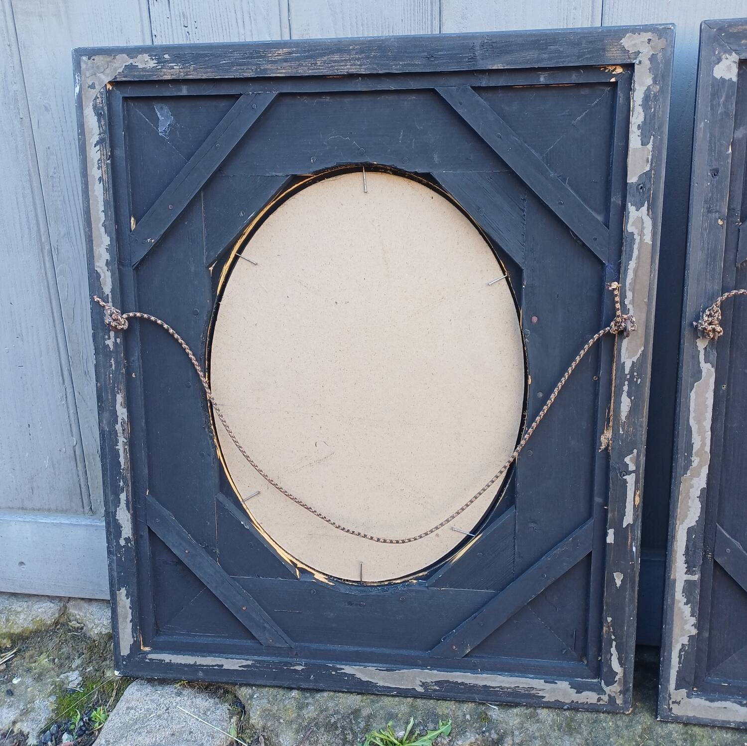 Pair of antique mirrors from the Napoléon III period, black and gilded.