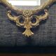 Louis XV style mirror in brass