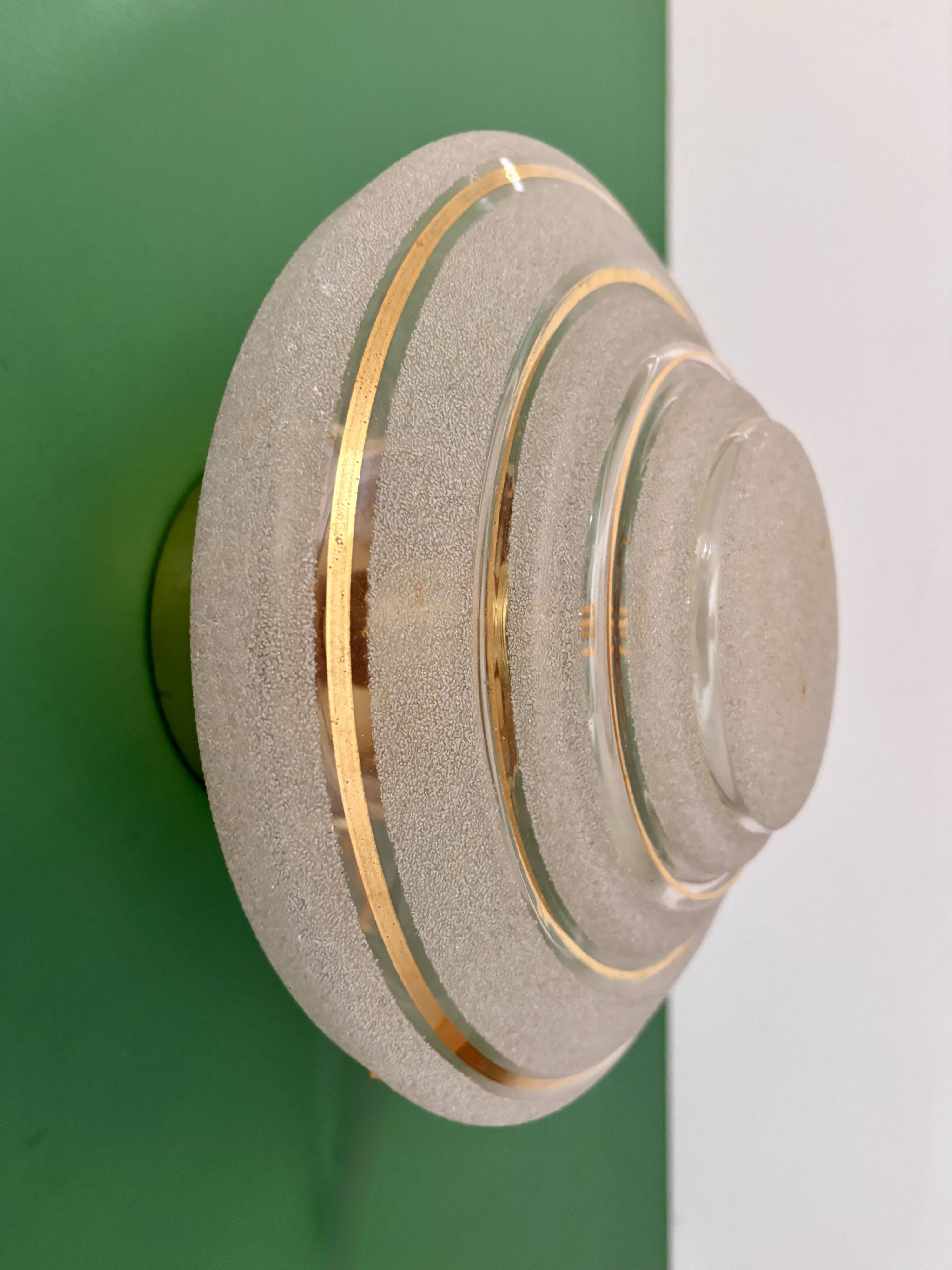 Old glass globe wall/ceiling light in frosted white and gold.