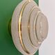 Old glass globe wall/ceiling light in frosted white and gold.