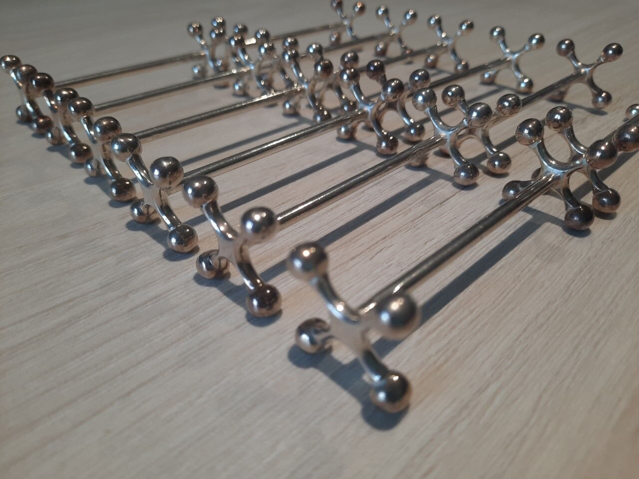 Set of 12 silver metal knife holders