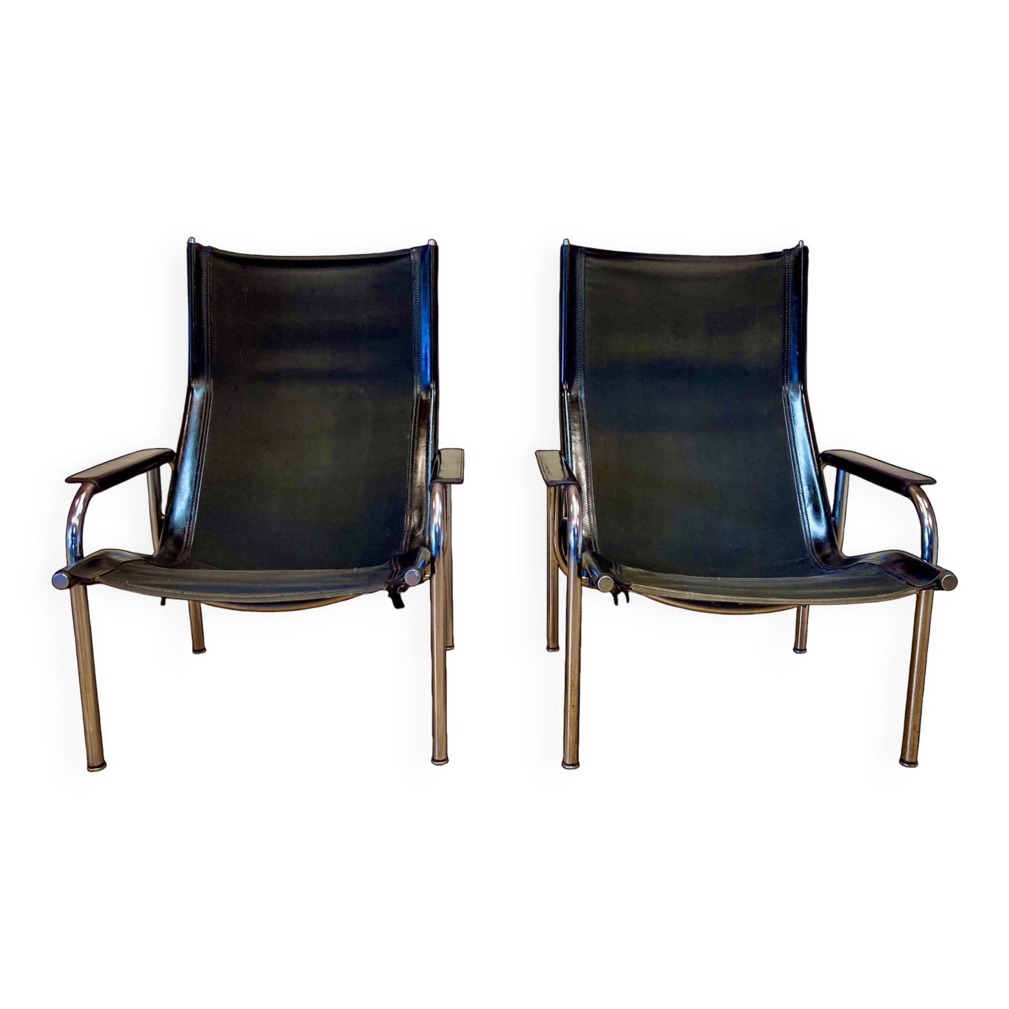 Set of 2 black leather and chrome reclining chairs designed by Hans Eichenberger.