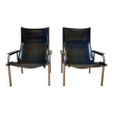Set of 2 black leather and chrome reclining chairs designed by Hans Eichenberger.