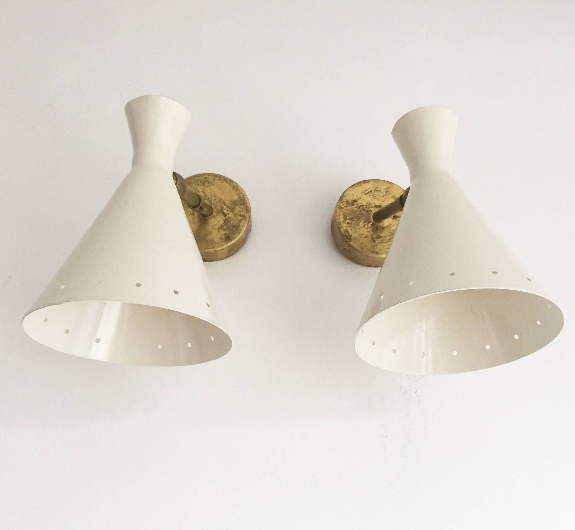 Pair of Italian wall sconces in brass and lacquered iron, 1950s design.