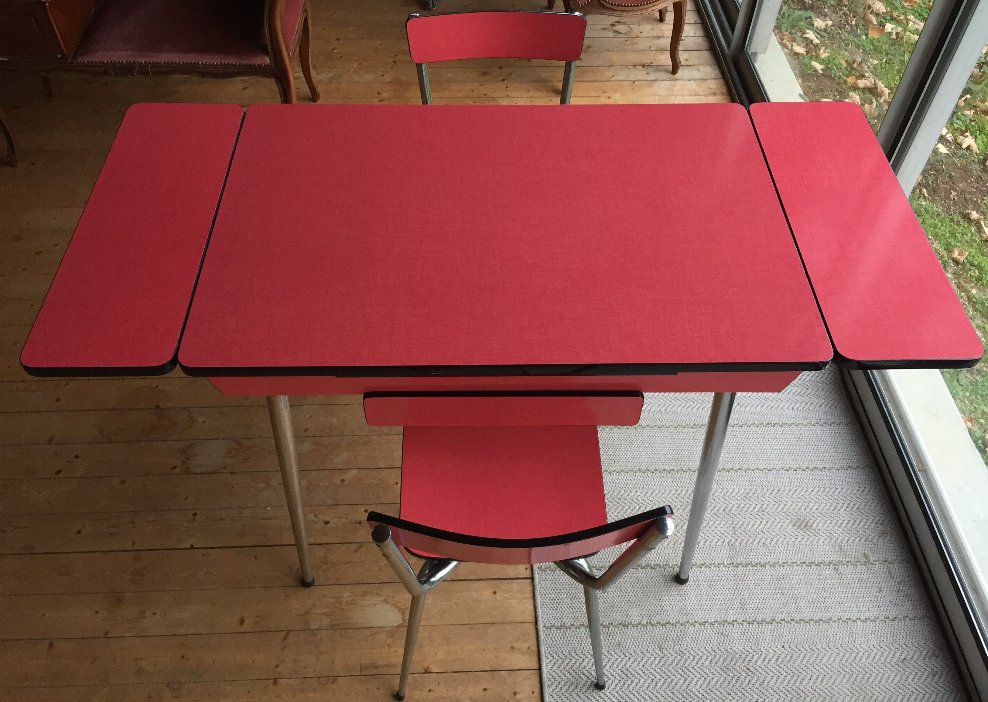 Table set and 2 vintage vintage pale red formica chairs